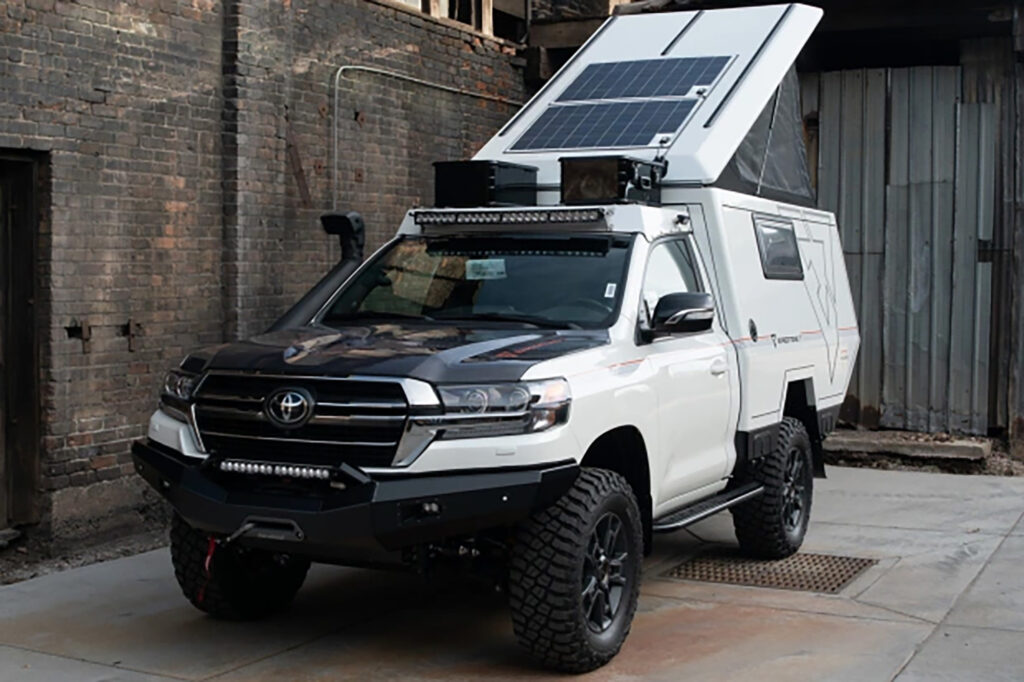 Photo of a 78-Series Toyota Land Cruiser listed on the Bring a Trailer digitial auction platform, outfitted for overlanding.