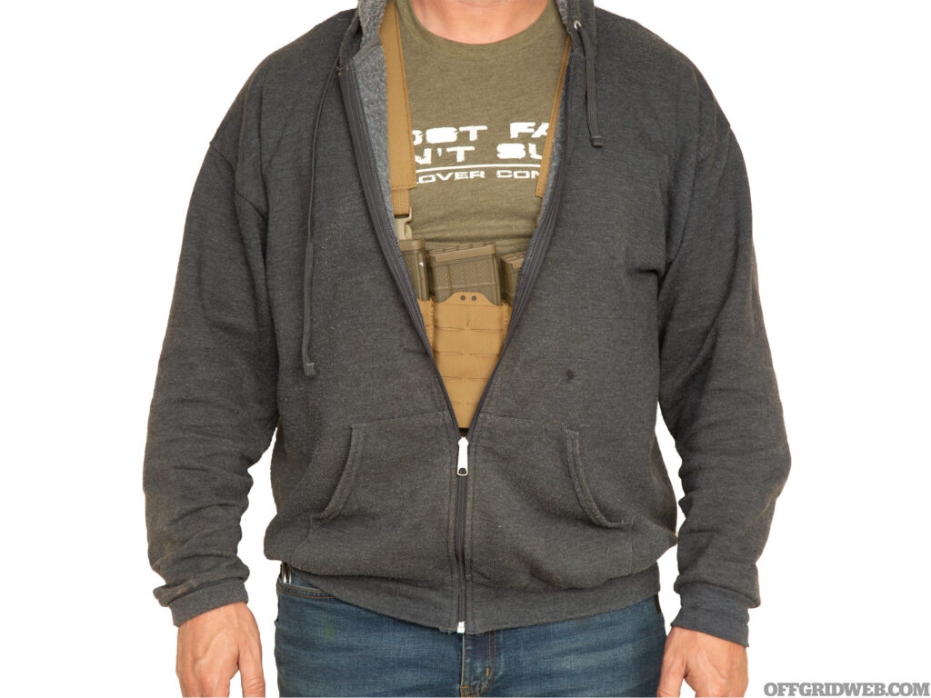 Studio photo of the Parashooter Pathfinder chest rig worn in a minimalist styler underneath a sweatshirt. 