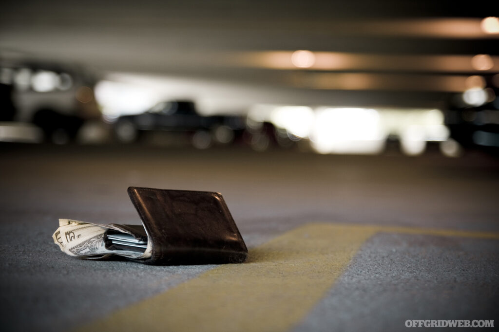 Photo of a lost wallet lying on the ground in a parking garage.