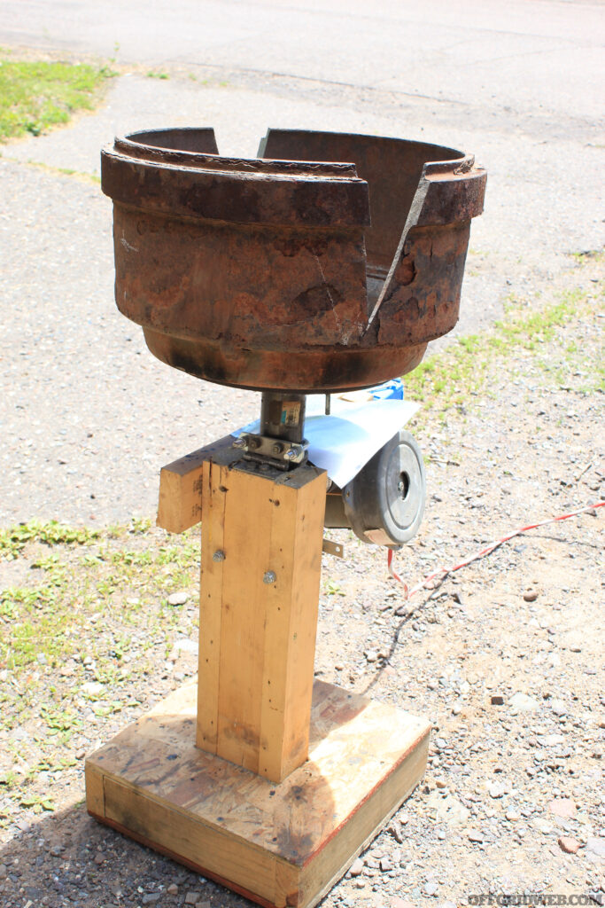 Photo of a home built brake-drum forge sitting safely in a driveway and a way from flammable objects.