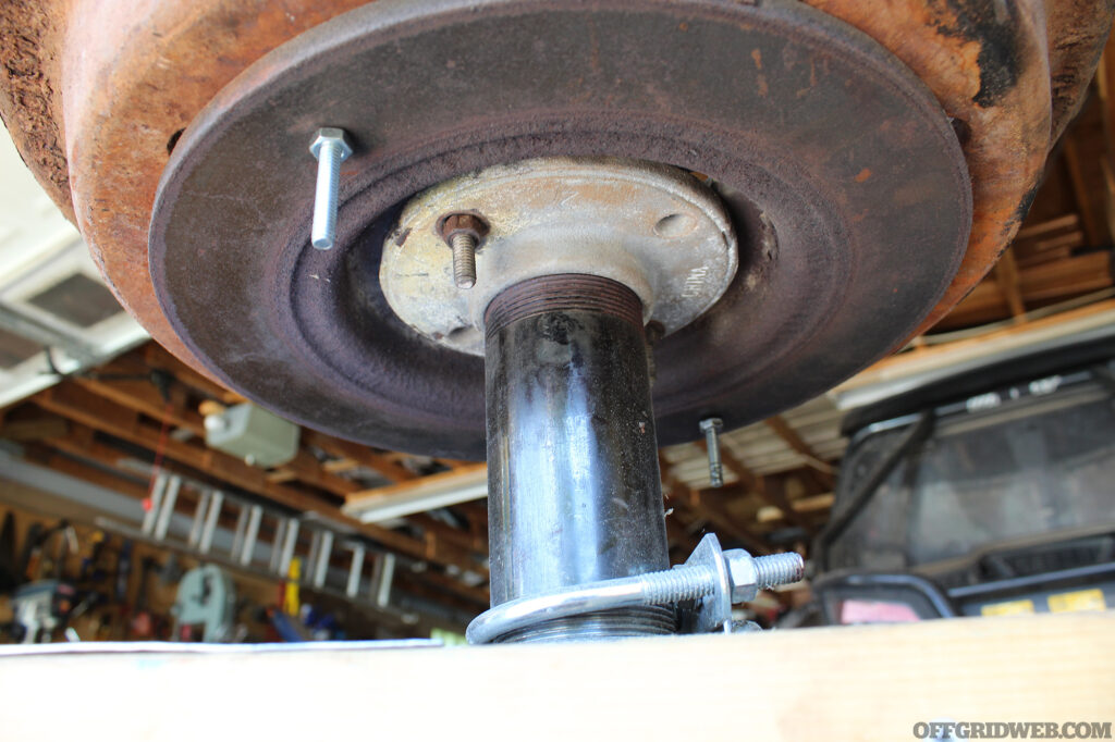 Photo of a flange connecting the blower to the bottom of a brake drum, all components of a hand made forge.