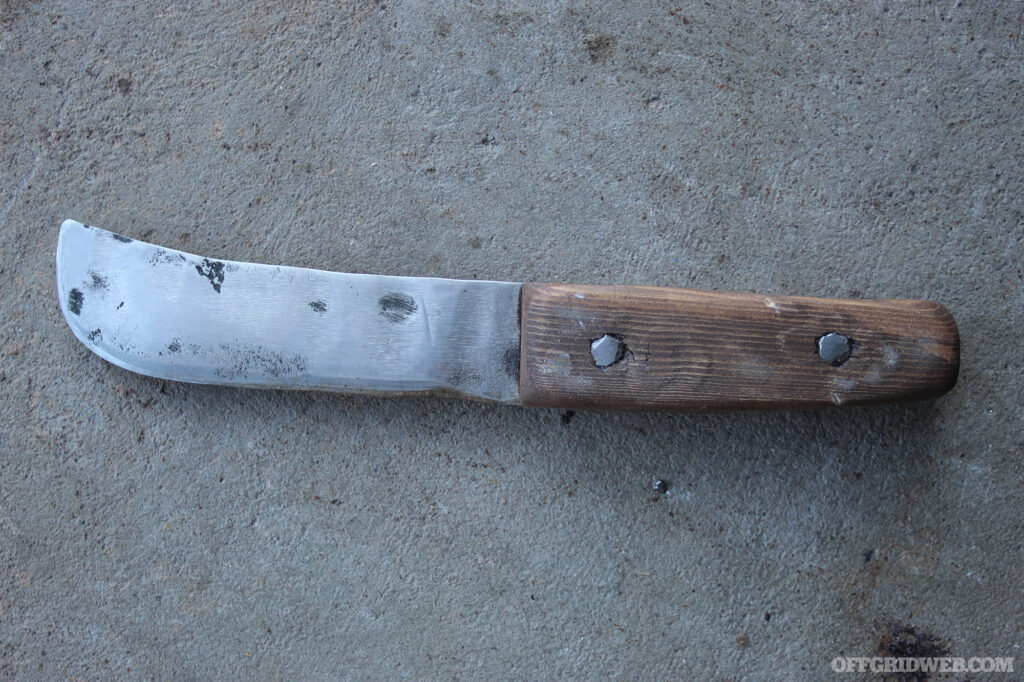 Photo of a crude knife forged from a chunk of iron rebar.