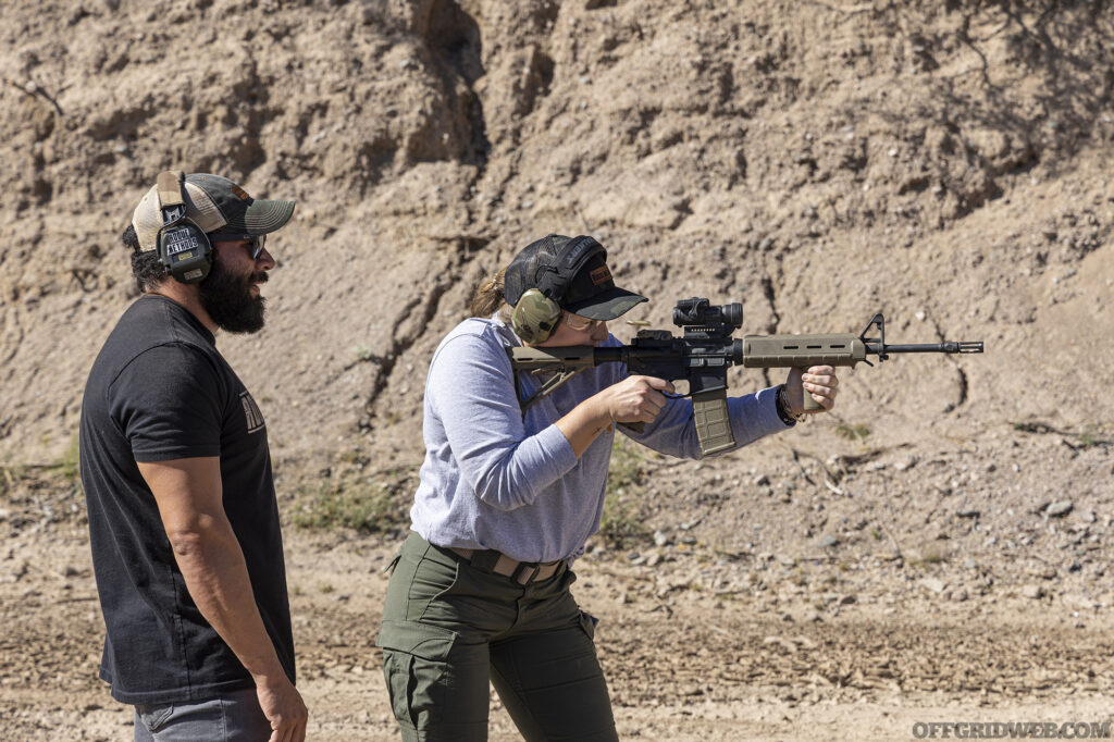 Raul Martinez overseeing a student during a low profile carbine class.