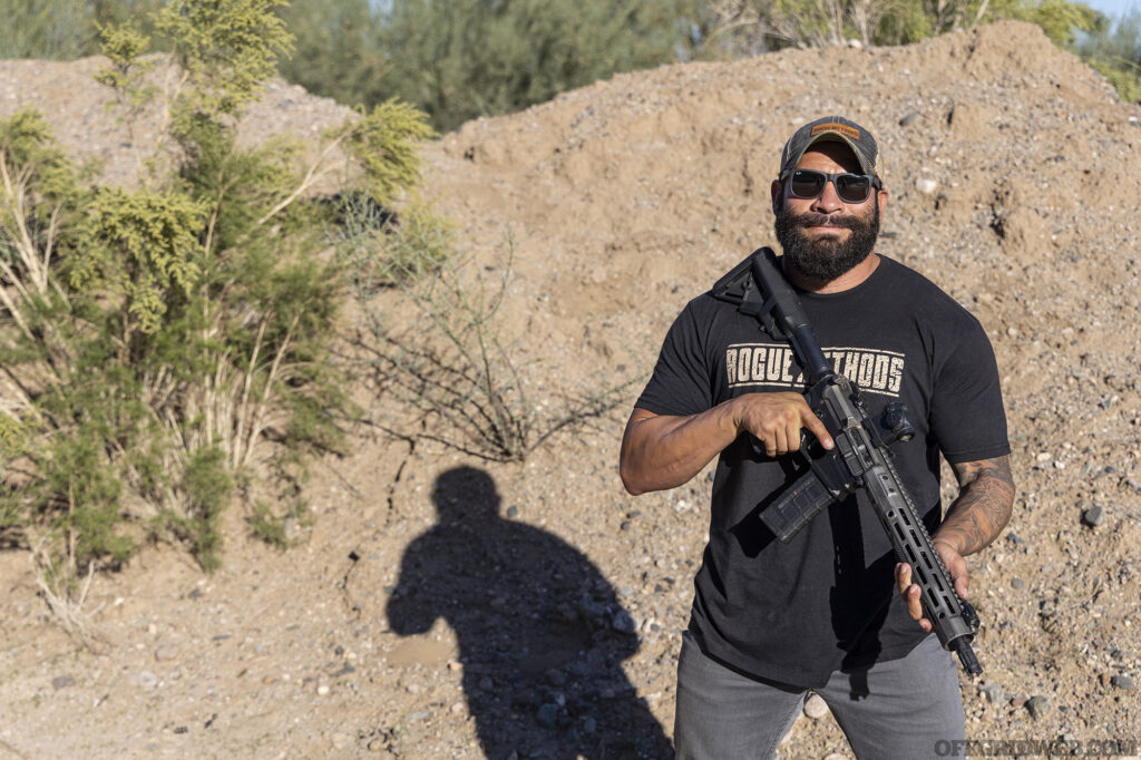 Portrait of Raul Martinez posing with his low-profile carbine.