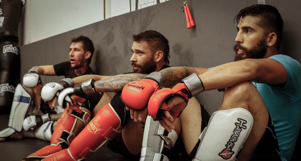 Raul Martinez resting during combatives training.