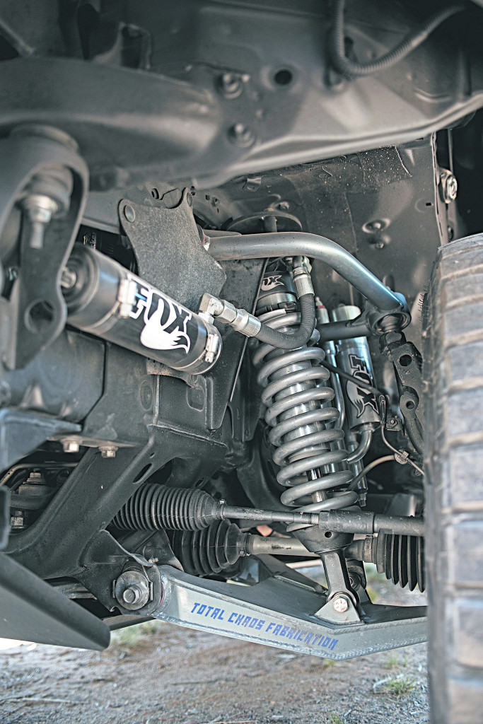 On this bug out toyota tacoma, Total Chaos Upper and Lower arms are part of their +2 Race Series Long Travel kit, increasing the track, suspension travel, and height. The Fox 2.5 DSC Coilovers with remote reservoir ensures no terrain is impassible.