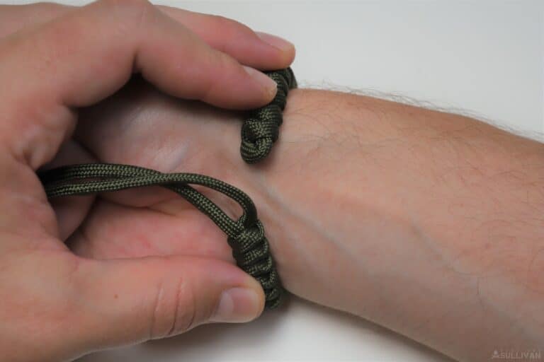 snake knot paracord bracelet measuring the bracelet against the wrist