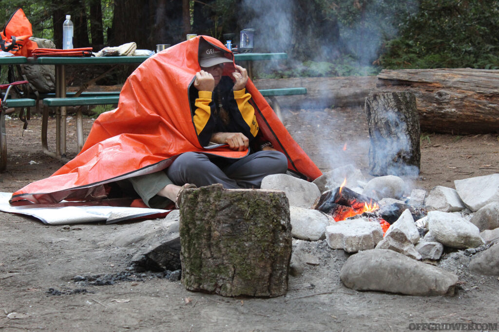 Adam and Amy demonstrate how to warm up to prevent hypothermia.