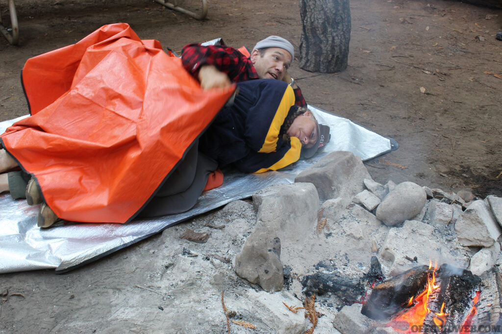 Adam and Amy of Coyne Survival School demonstrate how to warm up to prevent hypothermia.