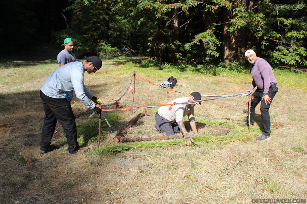 Students at Coyne Survival School build a signal triangle to attract searchers.