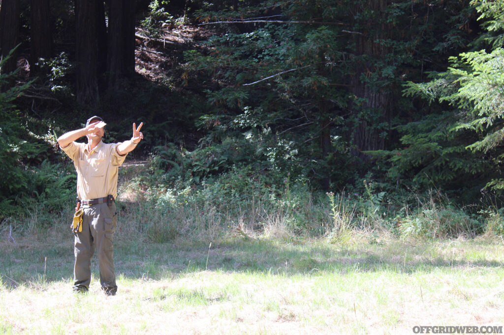 Adam Mayfield demonstrating the use of a signal mirror at Coyne Survival Schools Survival Certification Course.