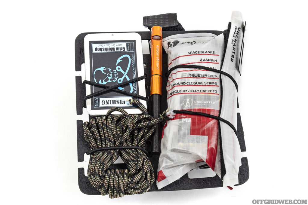 Studio photo of the emergency kit that is packed in the foraging satchel.