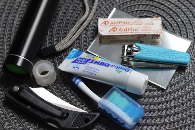 small flashlight mini stapler mini toothbrush small toothpaste tube tiny roll of adhesive tape