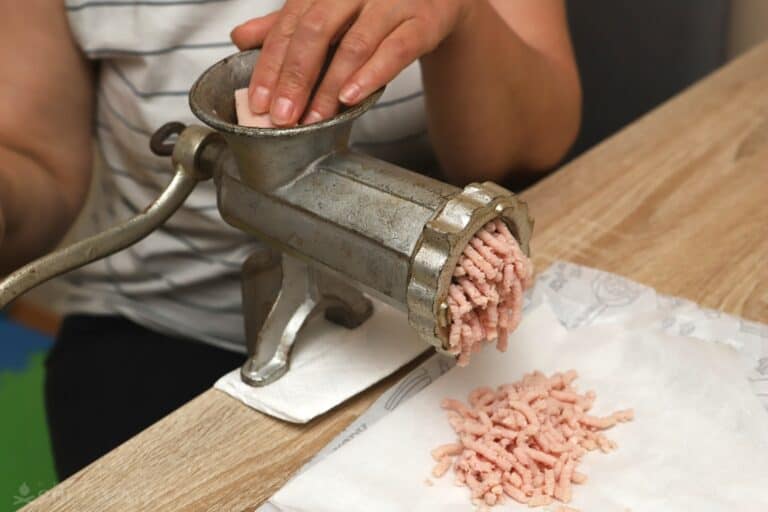 grinding pork with a manual grinder