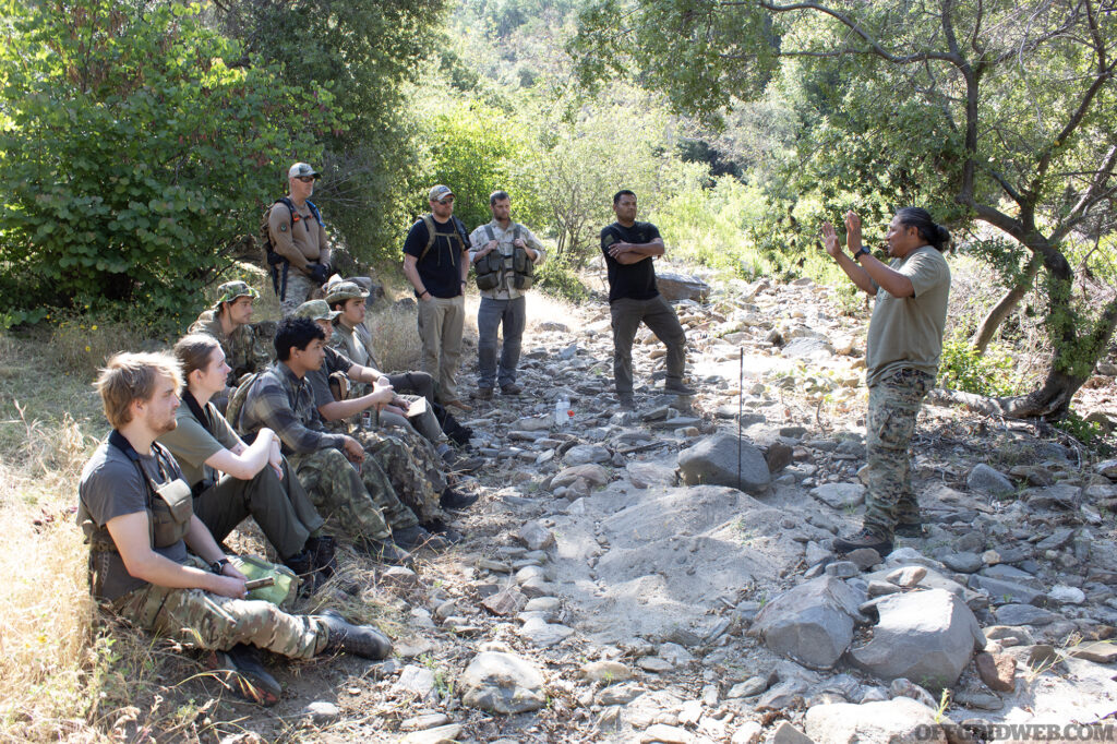 Assistant Instructor Hooee teaches students in an outdoor setting.