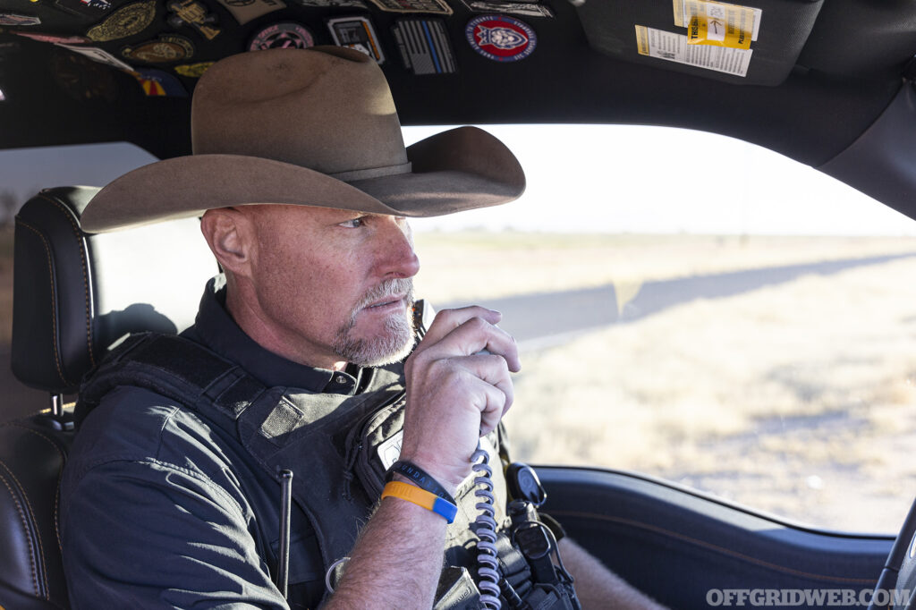 Photo of Mark Lamb talking on the radio.