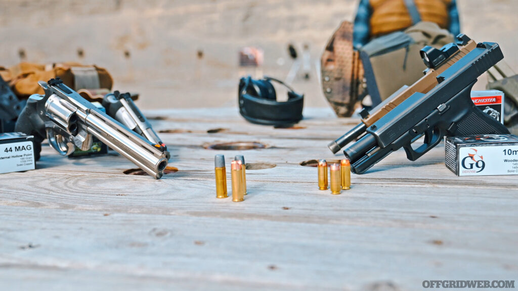 Photo of several firearms displayed on a table.