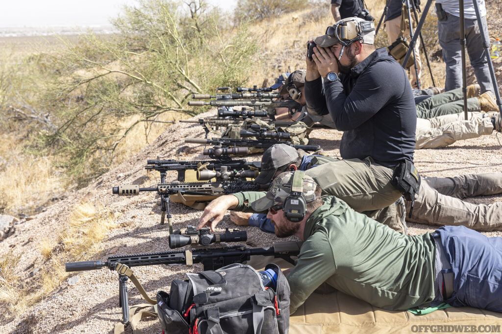 Photo of several students in the prone on a firing line.