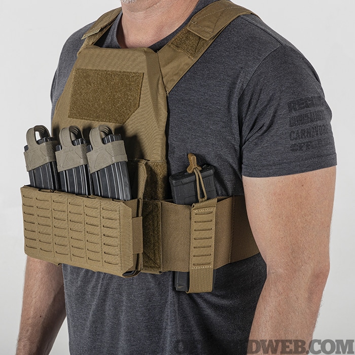 A man wearing a haley strategic concealable plate carrier with magazines attached.