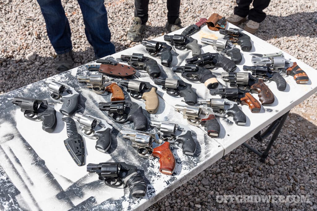 image of many wheelguns on a table at the firing range