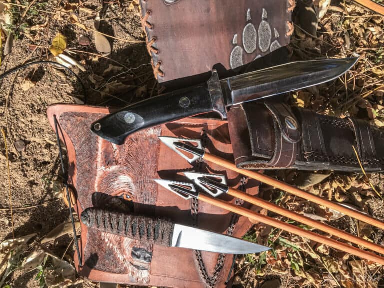 hunting gear two knives arrows and bags