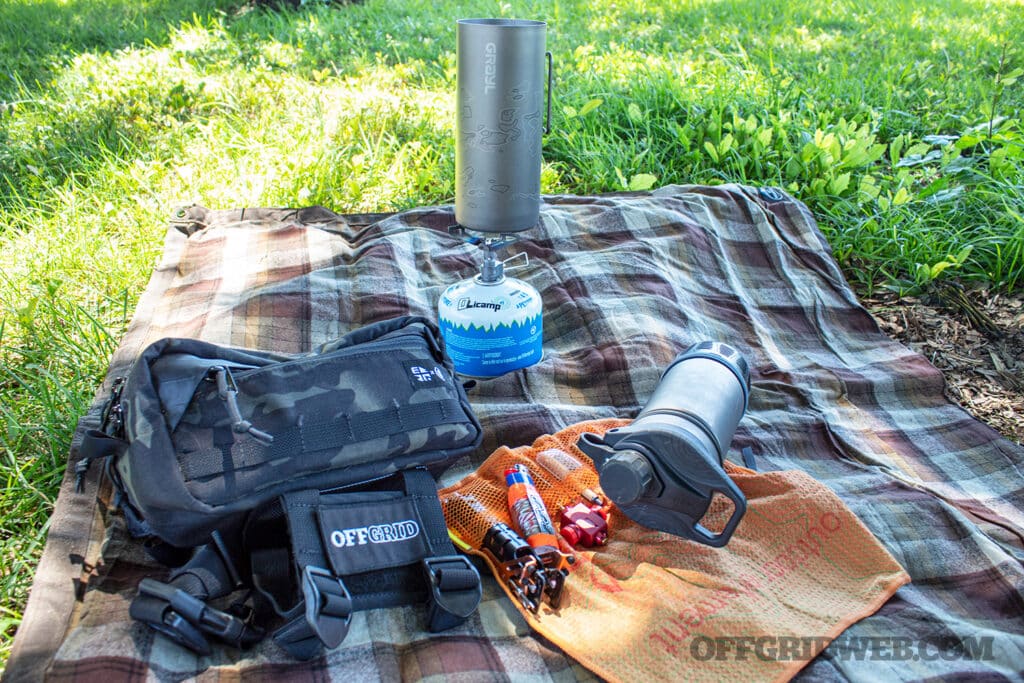 Image of gryal georpress among outdoor gear with stove