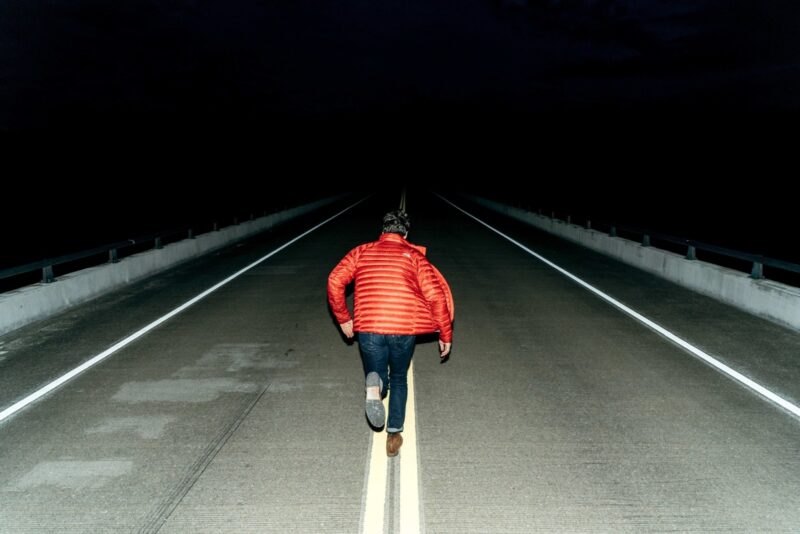 man running away on street