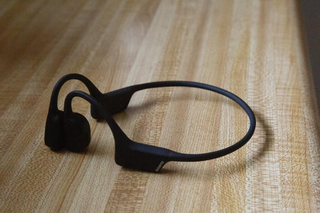 Suunto headphones lying on a counter.