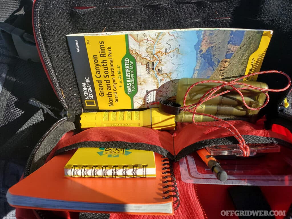 image of maps and search and rescue gear