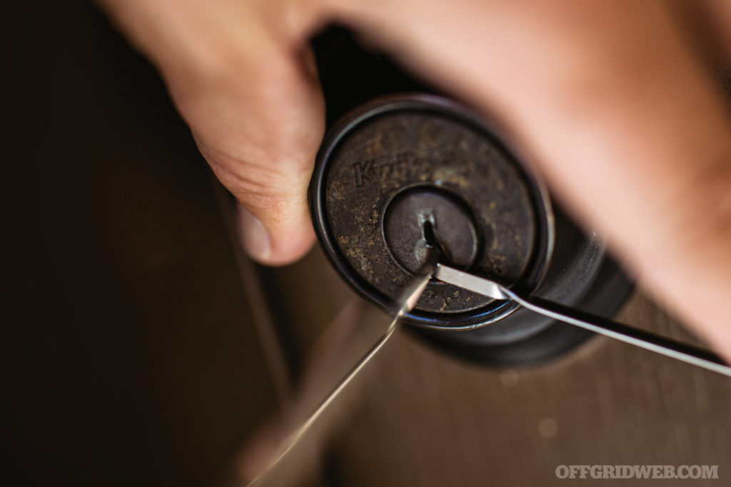 Image of lock picking a door lock