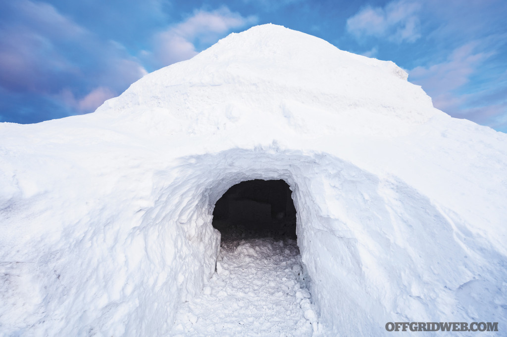 a snow shelter built while winter hiking