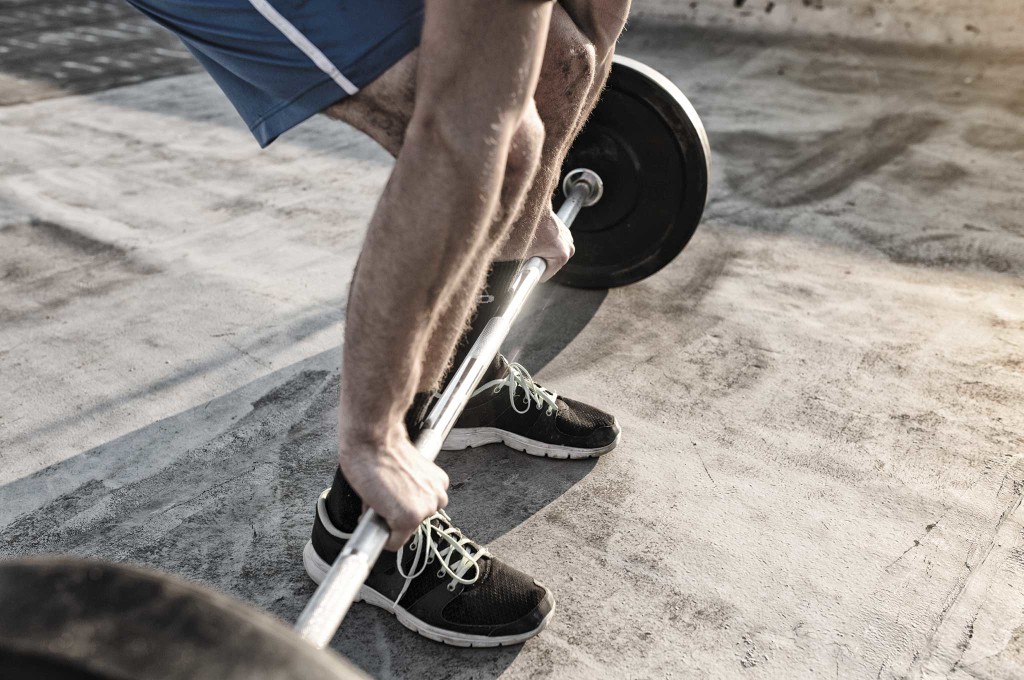 A person picking up weights.